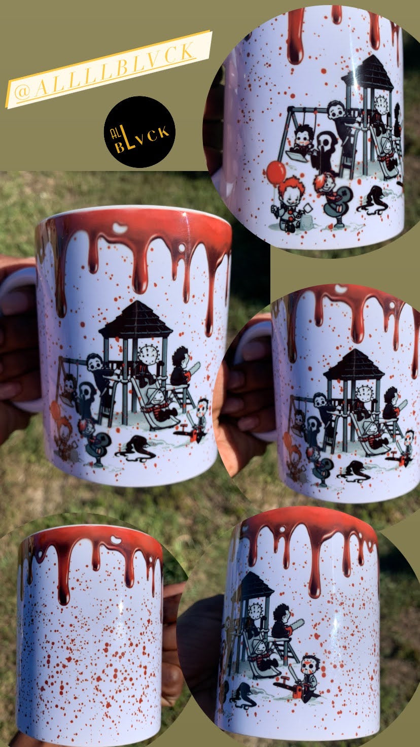 This white ceramic mug comes blood stained with our favorite Halloween villains on the playground. Material: White ceramic mug Dimensions: 11 and 15 oz. Care Instructions: Mug dishwasher and microwave safe.